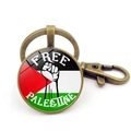 Bronze Palestine keychain with Free Palestine fist icon and glass dome pendant - Fist Free Palestine Style (Copper 1)