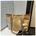 Detail view of large canvas tote bag with contrast handles and plush sheep charm - Khaki With Pendant