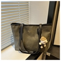 Olive green tote bag detail with golden text and cute plush doll charm accessory - Black With Pendant