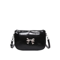 Glossy black patent leather shoulder bag with a silver metal bow accent and zipper - Black