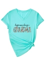 Detail eines mintgrünen T-Shirts mit V-Ausschnitt, Blumen-Print und geknotetem Saum - S / Tiefwasserblau