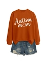 Detail of Autism Mom sweatshirt fabric texture with puzzle piece print and distressed denim - Burnt Orange (White Font)