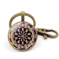 Bronze keychain featuring a colorful dartboard pattern under a glass dome pendant - Style 1 / Bronze