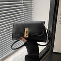 Vintage black leather shoulder bag with gold metal clasp and long strap detail - Black
