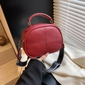 Deep red leather pillow bag with wide stripe strap and textured cross stitching - Red