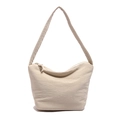 Beige pleated hobo bag in durable canvas fabric with minimalist shoulder strap design - White
