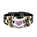 Detailed macro view of woven leather bracelet featuring London Tower Bridge and Big Ben charm - London Elements Heart Collection Style (JY009041-9)