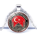 Detailed close-up of Istanbul Turkey souvenir necklace with flag and mosque design - Turkey