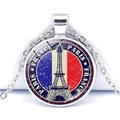 Detail of vintage Paris Eiffel Tower pendant with French flag design on silver chain - France Style