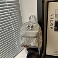 Metallic silver pleated mini backpack with a stylish bow decoration and front zipper pocket - Silver