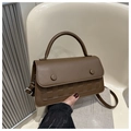 Detail of dark brown faux leather handbag with checkerboard pattern and round buckle - Brown