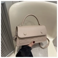 Detail of beige faux leather crossbody bag with checkered texture and decorative buttons - Khaki