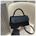 Detail of black leather handbag featuring woven checkerboard panel and round buttons - Black