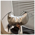Detailed view of silver metallic crescent bag with soft textured leather and slim strap - Silver