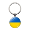 Detail of round metal keychain with Ukraine flag dome glass and silver ring - Ukraine