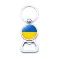 Macro detail of metal bottle opener keychain with Ukraine flag dome graphic - Ukraine