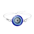 Detailed close-up of a silver-toned Evil Eye bangle with a blue glass nazar charm - Wave Pattern Concentric Evil Eye Style (JY009118-10)