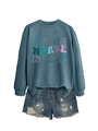 Flat lay of a grey-blue nurse sweatshirt with colorful text and distressed denim shorts - S / Blue