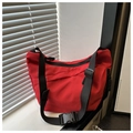 Detail of red large capacity tote bag with black adjustable strap and buckle closure - Red