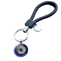 Blue Evil Eye keychain with black braided leather strap and round silver engraved metal tag - Radial Concentric Evil Eye (JY009122-5)