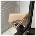 Close-up of the stylish beige shoulder bag with unique wavy flap and knotted strap detail - Khaki