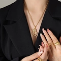 Gold plated Q letter crown pendant necklace with zircons shown on model with rings - Letter Q / Gold