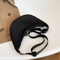 Versatile black nylon crescent bag with adjustable shoulder strap on white background - Black