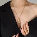 Golden crown initial X letter pendant necklace with rope chain on model - Letter X / Gold