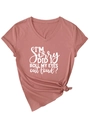 Detail of dusty rose V-neck tee with rolled sleeves and knot hem showing fabric texture - Rose Gold (White Font)