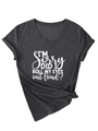 Detail view of the rolled sleeves and knotted hem on a V-neck slogan t-shirt - Black Marled (White Font)