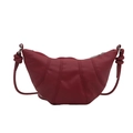 Burgundy croissant shoulder bag in matte faux leather with elegant knotted strap detail - Red