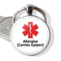 Detail of medical alert keychain with red star of life and allergies warning text - Allergies Carries Epipen