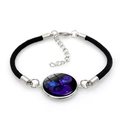 Detailed view of Aquarius constellation bracelet with black cord and glass pendant - Black