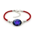 Detail of red braided Cancer zodiac bracelet with glowing blue crab glass pendant - Cancer (4Cancer) / Red