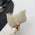 Cream white faux crocodile felt baguette bag with gold and plastic chain strap detail - White
