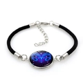 Adjustable woven bracelet featuring Aries zodiac sign with purple gradient charm - Black