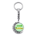 Macro detail of rotating St. Patrick's Day moon keychain with Good Luck glass charm - Festival Hat and Clover Style (JY009293-7)
