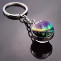 Macro view of Aurora Borealis glass cabochon keychain with vibrant purple and green colors - Tri-color Aurora Snow Mountain Style (JY009320-7)