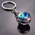 Macro view of Aurora Borealis glass ball keychain on a black reflective surface - Colorful Aurora Patch Style (JY009320-6)