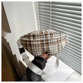 Close-up of plaid tweed waist bag with white woven strap and black plastic buckle detail - Khaki