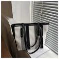 Detail of classic black and white striped tote bag with leather handles in natural sunlight - Black Coarse Striped