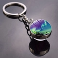 Double-sided glass ball keychain featuring a green aurora forest scene in silver metal - Deep Night Aurora Style (JY009320-3)
