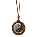 Close-up of wooden Tai Chi pendant with spiral carvings and wax cord on white background - Black White Gold Art Style (JY009354-7)