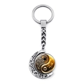 Close-up of rotatable Yin Yang pendant with vintage crescent moon and silver key ring - Retro Hollow Tai Chi Style (JY009352-12)