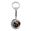 Detail of silver moon keychain with rotating yin yang pendant and hollow patterns - Stylized Tai Chi Style (JY009352-9)