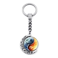 Close-up of a silver spinning yin yang keychain with crescent moon frame and rotating charm - Elements Fusion Style (JY009352-6)