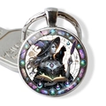 Detail of a round fantasy witch and black cat illustration pendant on silver keychain - Magic Book Black Cat Witch(JY009410-11)