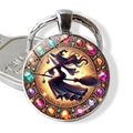 Macro view of a crystal-encrusted witch keychain with purple hair on a golden broom - Gold Base Purple Hair Witch(JY009410-10)