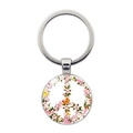 Close-up of a silver peace sign keychain with floral cherry blossom and butterfly design - Pink White Cherry Blossom Butterfly Peace Sign (Silver-6)