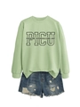Flat lay of light green PICU pediatric sweatshirt paired with frayed denim shorts - Olive Green (Black Font)